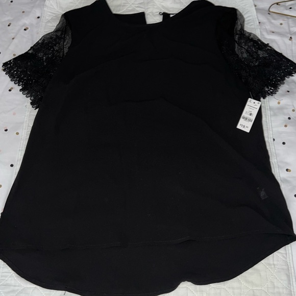 Black top with lace short sleeves. Single button closer at the back. - Picture 2 of 6